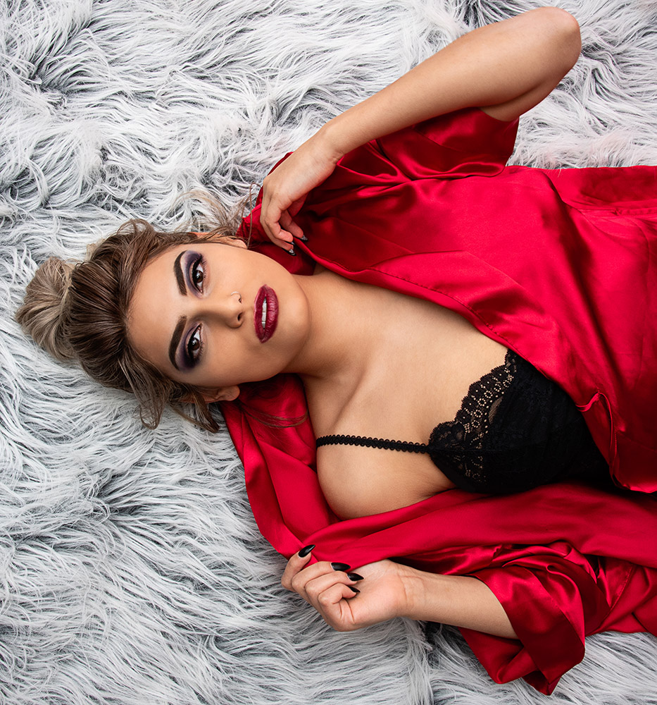 Blonde girl with messy bun and dramatic makeup wearing red silk robe over black lingerie. Alyssa Bryn Photography. Bryssa. Bryssa Blog.
