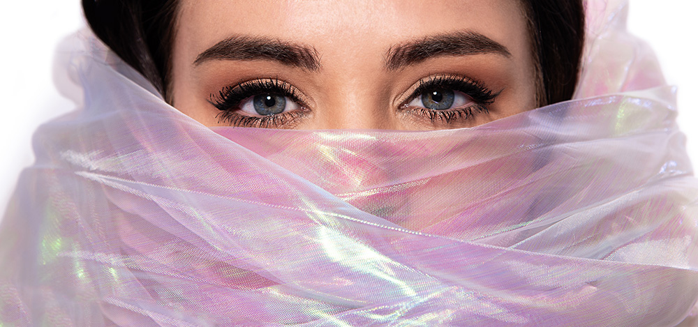 Dark hair girl with milticolor plastic like material wrapped around her head showing off georgous blue eyes. . Alyssa Bryn Photography. Bryssa. Bryssa Blog.