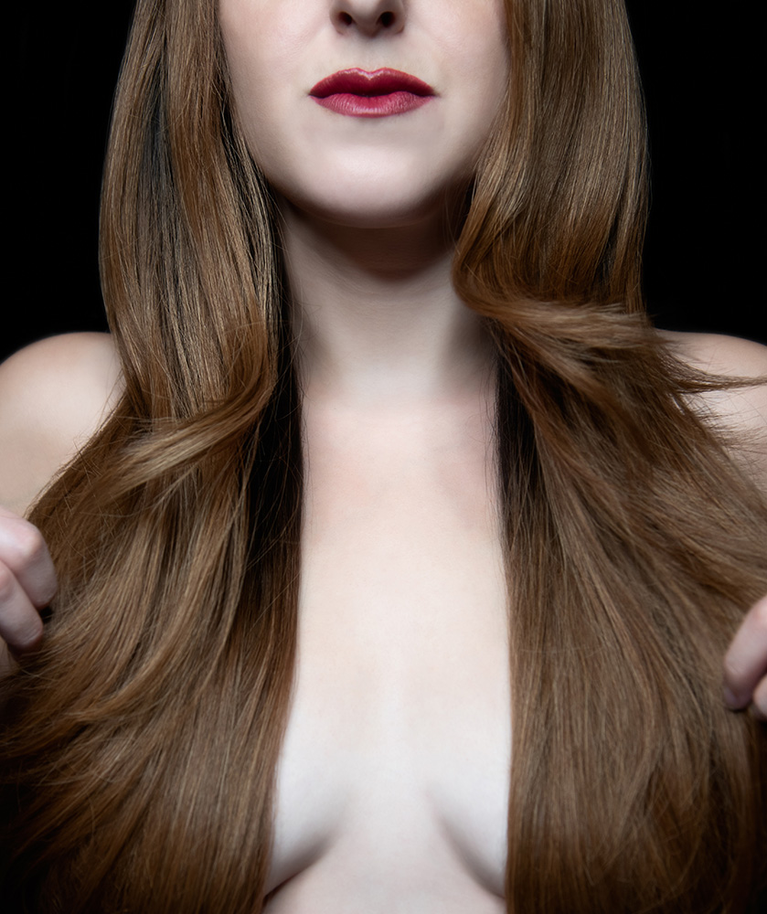 Girl wearing red lipstick and very long brown hair uses it to cover her chest. Alyssa Bryn Photography. Bryssa. Bryssa Blog.