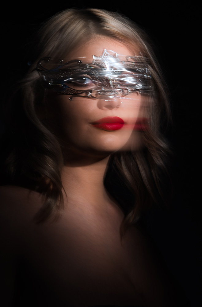 Stop motion blonde hair brown eye girl wearing red lipstick and a silver mask with a diamond neckless. Alyssa Bryn Photography. Bryssa. Bryssa Blog.