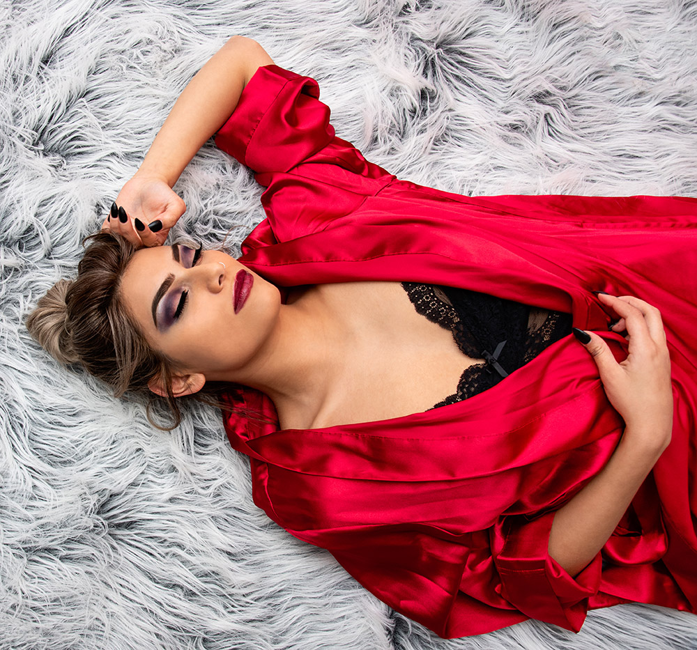 Blonde girl with messy bun and dramatic makeup wearing red silk robe over black lingerie. Alyssa Bryn Photography. Bryssa. Bryssa Blog.