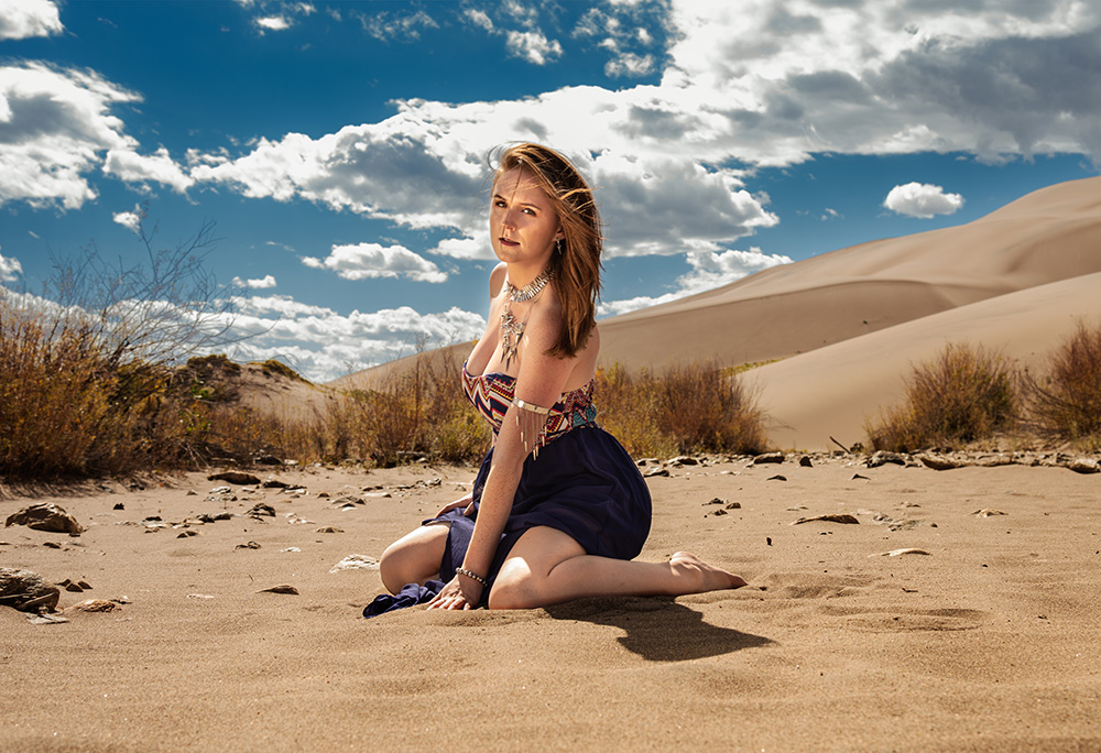 Girl with silver jewelry and slue tribal patterned dress in Sand Dunes National Park. Alyssa Bryn Photography. Bryssa. Bryssa Blog.